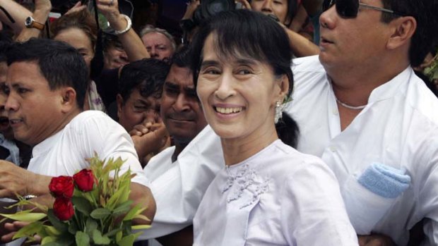 Victorious ... Aung San Suu Kyi arrives at her NLD party headquarters.