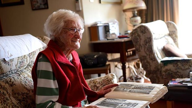 Myrtle Bayliss with her scrapbook.