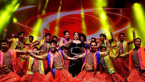 Bollywood actress Madhuri Dixit (centre) performs in <i>Temptation Reloaded</i> as part of Parramatta's Parramasala Festival 2013.