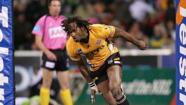 Lote Tuqiri scores a try for Wests Tigers, who squeezed past the Raiders 26-24 last night.