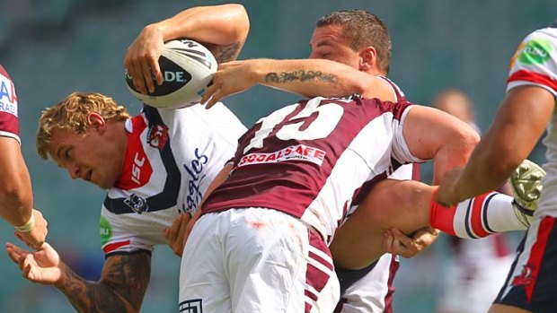 A friend in need ... Roosters hooker Jake Friend is tackled by Jamie Buhrer and Anthony Watmough yesterday.