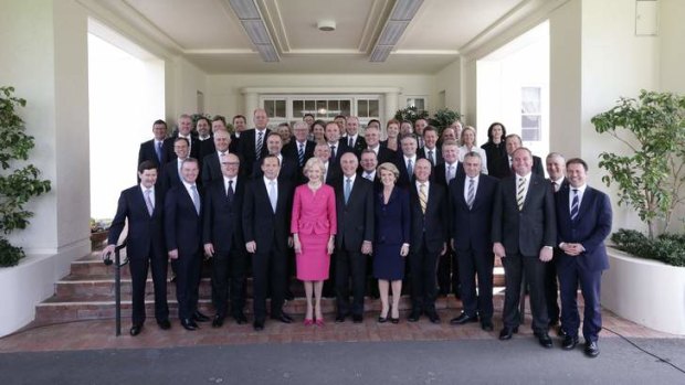 Governor-General Quentin Bryce poses for photos with Prime Minister Tony Abbott and his new ministry at Government House in Canberra on Wednesday.