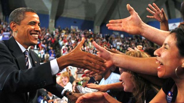 Winning smile: Democratic presidential nominee Senator Barack Obama presses the flesh at a campaign rally in Virginia.