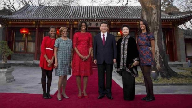 Red carpet: Michelle Obama with her daughters Malia (right), Sasha (left), and her mother Marian Robinson (second left), with Chinese President Xi Jinping and his wife Peng Liyuan, at the Diaoyutai State Guesthouse in Beijing.
