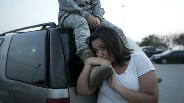 Luci Hamlin and her husband Specialist Timothy Hamlin wait to return to their home on the base at Fort Hood, Texas, after the shootings on April 2.