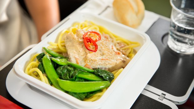 Qantas's economy meal: Barramundi poached in a spiced coconut sauce with noodles, sugar snaps, choy sum and chilli. 