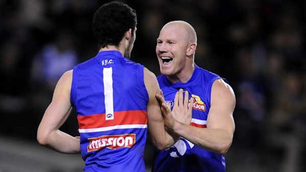 Barry Hall and Jarrad Grant celebrate a goal.