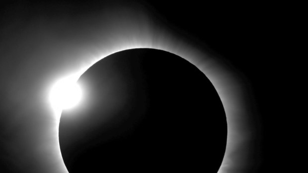 This photo provided by Bob Baer and Sarah Kovac, participants in the Citizen CATE Experiment, shows a "diamond ring" shape during the 2016 total solar eclipse in Indonesia. For the 2017 eclipse over the US, the National Science Foundation-funded movie project nicknamed Citizen CATE will have more than 200 volunteers trained and given special small telescopes and tripods to observe the sun at 68 locations in the exact same way. The thousands of images from the citizen-scientists will be combined for a movie of the usually hard-to-see sun's edge.