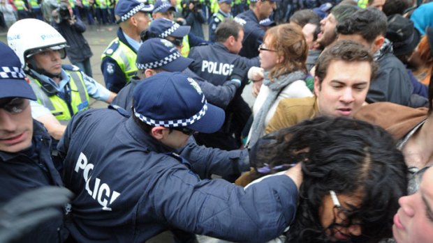 Police move protesters along Swanston Street during last month's protests.