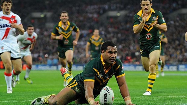 Peaks and troughs: Tony Williams scores for the Kangaroos against England in 2011.