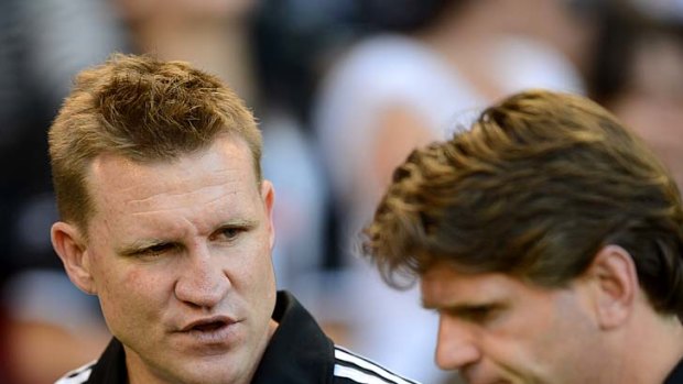 Collingwood coach Nathan Buckley with assistant Robert Harvey.