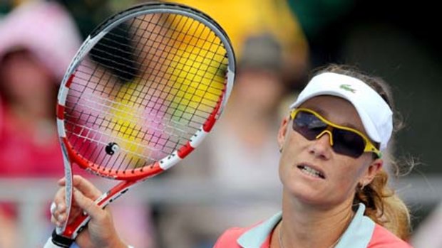 Sam Stosur of Australia reacts after missing a vital shot in her three-set loss.
