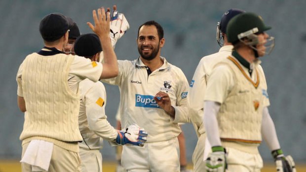 Fawad Ahmed celebrates one of  his four wickets.