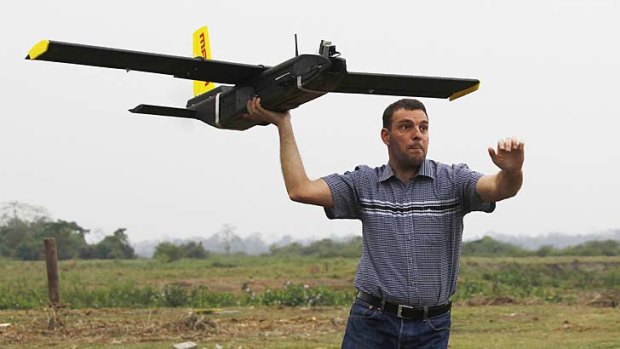 Remo Peduzzi, managing director of Research Drones, launches a UAV for flight at the Kaziranga National Park.
