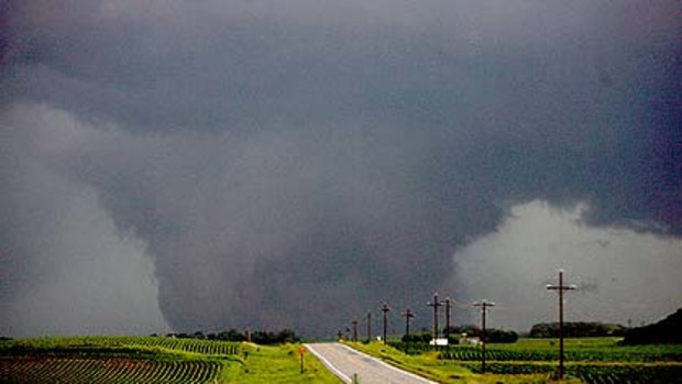 A large funnel cloud tornado touches down west of Albert Lea, Minnesota on Thursday.