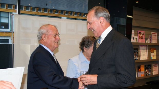 Johno Johnson (left), receiving the Papal Medal from former prime minister Paul Keating in 2006. 
