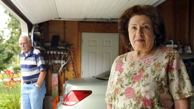 Al, left, and Sondra Tuchman say their garage-door opener is no longer opening and closing the door, and a representative of the door company told her they had received similar complaints from customers in nearby towns.