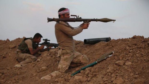 Peshmerga fighters guard a position against Islamic State (IS) militants 20 kilometres east of Mosul.