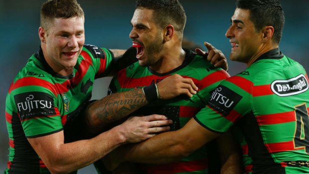 Greg Inglis feels the love from Chris McQueen and Bryson Goodwin.