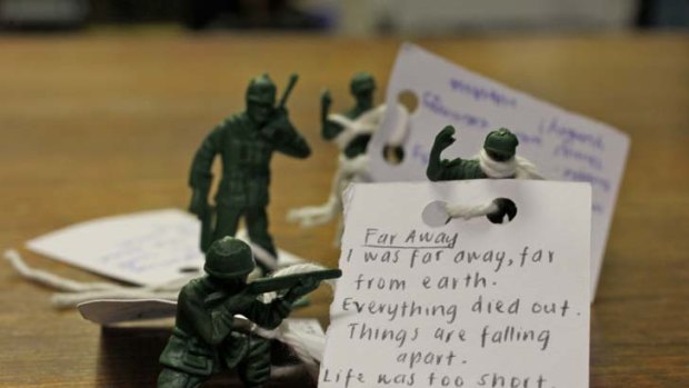 Fighting words ... poetry written by Marrickville students is attached to toy soldiers.