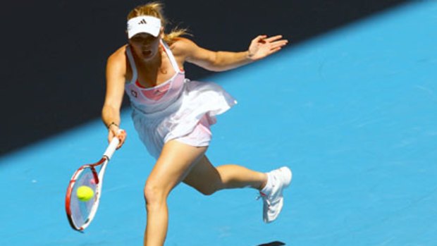 Caorline Wozniacki stretches for a ball at the 2011 Australian Open.