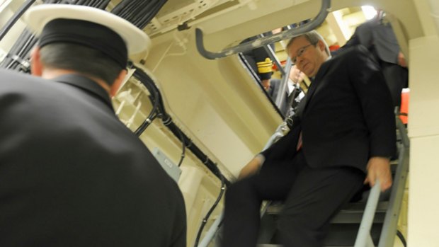 One step at a time: Kevin Rudd on board HMAS Stuart.