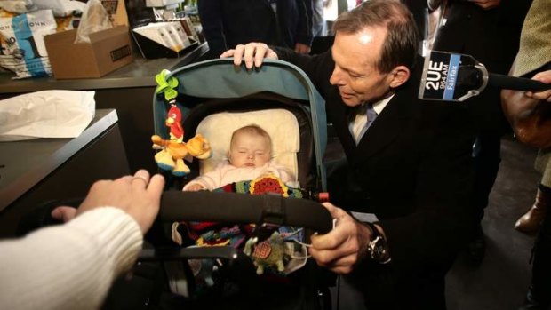 Opposition Leader Tony Abbott, on a street walk in Geelong, has tied his fortunes to his ''signature policy'' of his paid parental leave scheme.