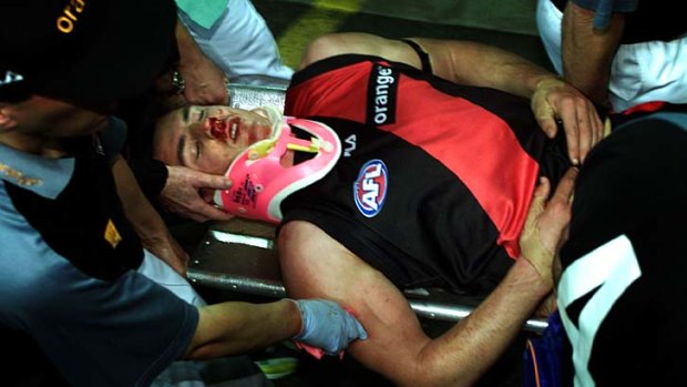 Matthew Lloyd is stretchered off the ground during the 2002 Elimination Final.