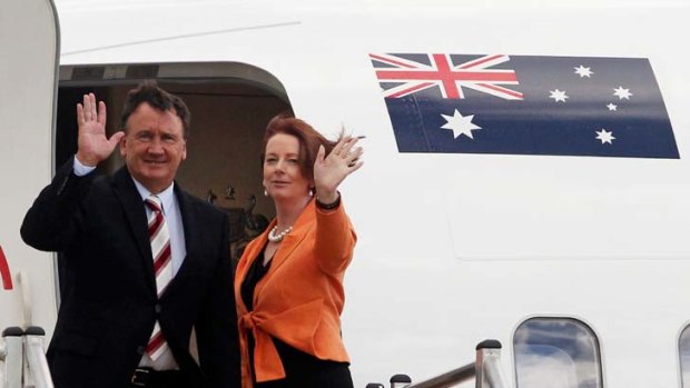 Leaving on a jet plane &#8230; Julia Gillard and her partner, Tim Mathieson, departing for Singapore yesterday.