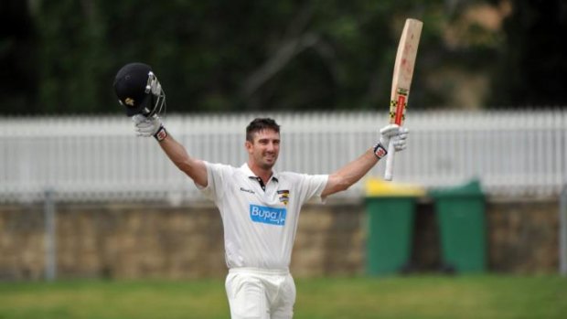 West Australian Shaun Marsh celebrates his century against NSW at Manuka Oval.