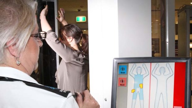 A passenger being scanned by a body scanner during a trial at Sydney's international airport last year.