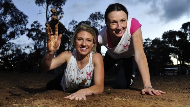 From left, Rochelle Riley of Casey and Sharon Moloney of O'Connor prepare for the Miss Muddy obstacle course event that will be held at Exhibition Park on Sunday.