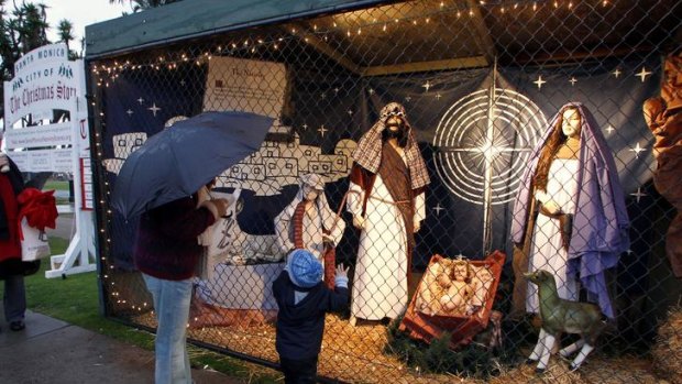 Two-year-old Ruben Lucas of Australia and his great grandmother Dot Brown look at a display showing the nativity scene in Palisades Park in Santa Monica, California.