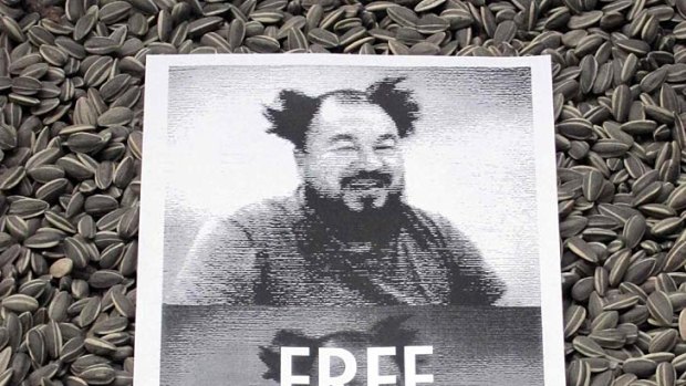 A protest poster placed on an Ai Weiwei work  at London's Tate Modern.