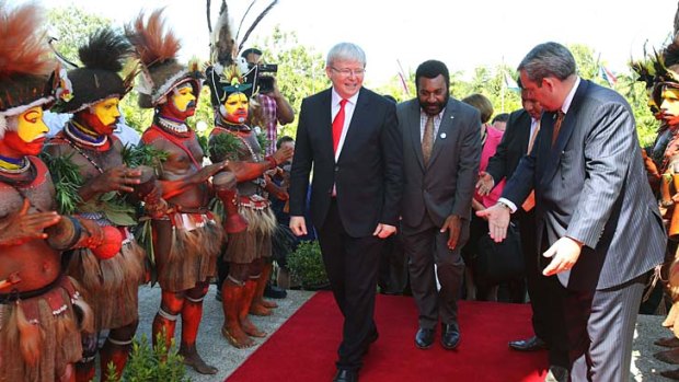 Traditional welcome: Prime Minister Kevin Rudd arrives in Port Moresby on Monday.