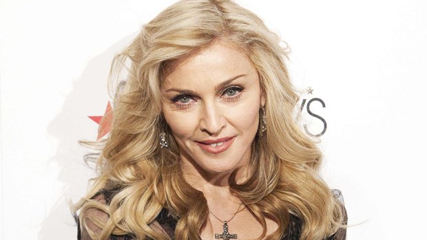 Madonna says she hasn't seen One Direction, but would love to work with Adele.
