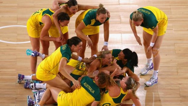 Ecstatic: The Diamonds collapse in a heap in their post-game celebrations.