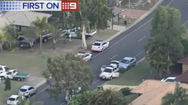 Police surround a house in Parkwood on the Gold Coast.