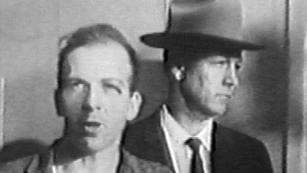 The chief suspect: Lee Harvey Oswald is led through the Dallas police station after the assassination of President Kennedy.