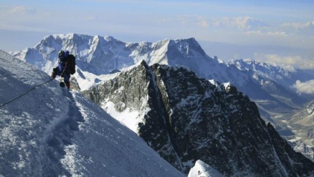 Top of the world: A climber pauses on the way to the summit of Mount Everest. A file photo released by mountain guide Adrian Ballinger of Alpenglow Expeditions.