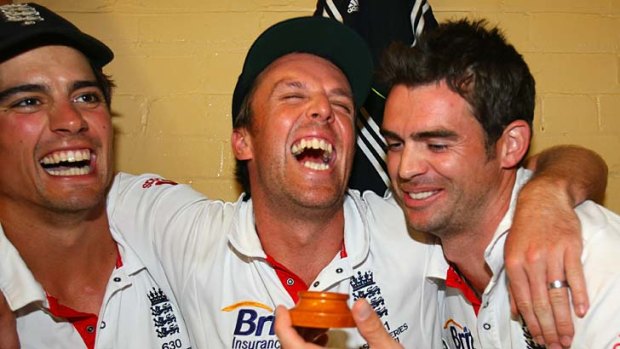 Alastair Cook, Graeme Swann and James Anderson of England celebrate winning the Ashes series 3-1, in Sydney in 2011.