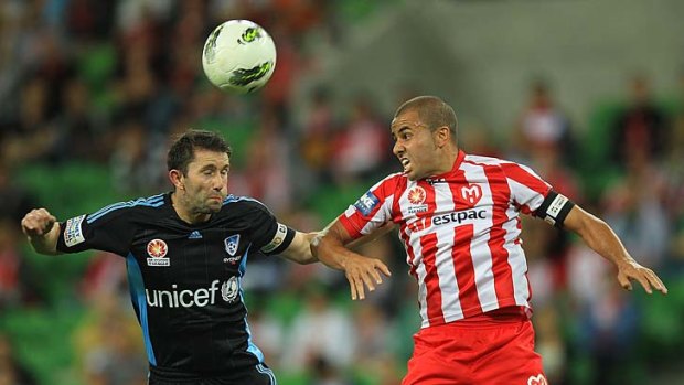 Heads up: Terry McFlynn (left) of Sydney takes on Heart's Fred at AAMI Park last night.