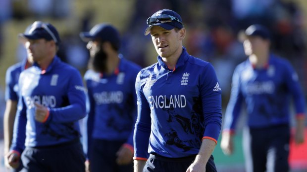 England captain Eoin Morgan walks off the ground with his teammates after their hammering in Wellington. 