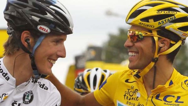 Alberto Contador gives main rival Andy Schleck a friendly pat on the shoulder.