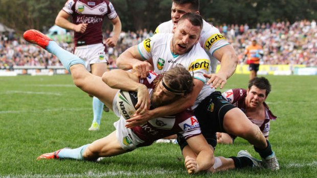 Wolfman cometh: David Williams scores for Manly against Penrith.