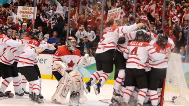 Sweet celebration ... The crowd erupts as the Canadian women's team wins ice hockey gold.