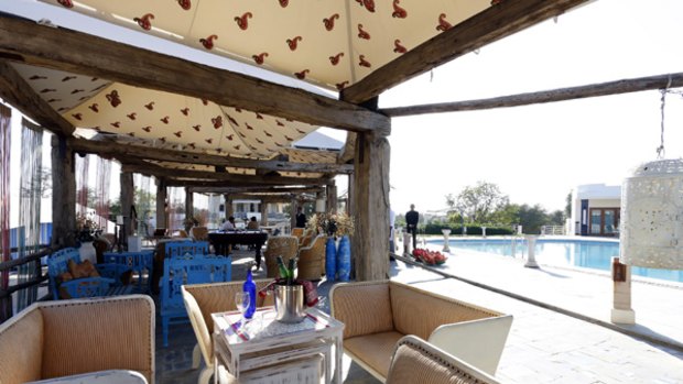 Recycle of life ... palace beams are built into a poolside canopy