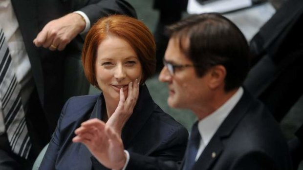 Having a laugh ... Prime Minister Julia Gillard listens to her Climate Change Minister, Greg Combet.