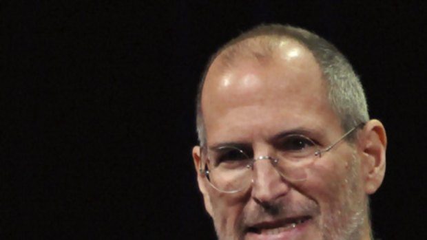 Truly revolutionary ... Steve Jobs holds the new  iPad.