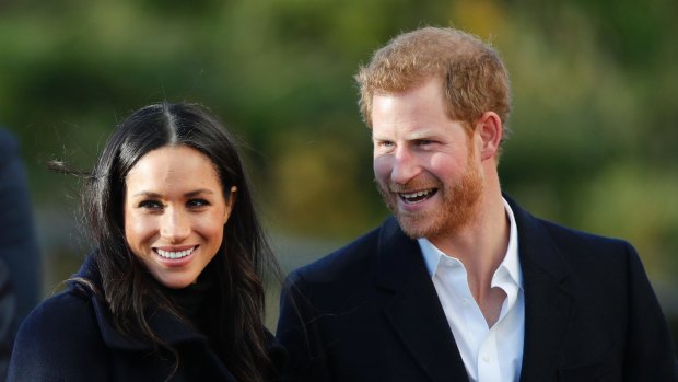 Britain's Prince Harry and his fiancee Meghan Markle arrive at Nottingham Academy in Nottingham, England.